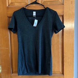 Women’s V-neck T-shirt. Black shirt sleeve Brand new, tags on it.